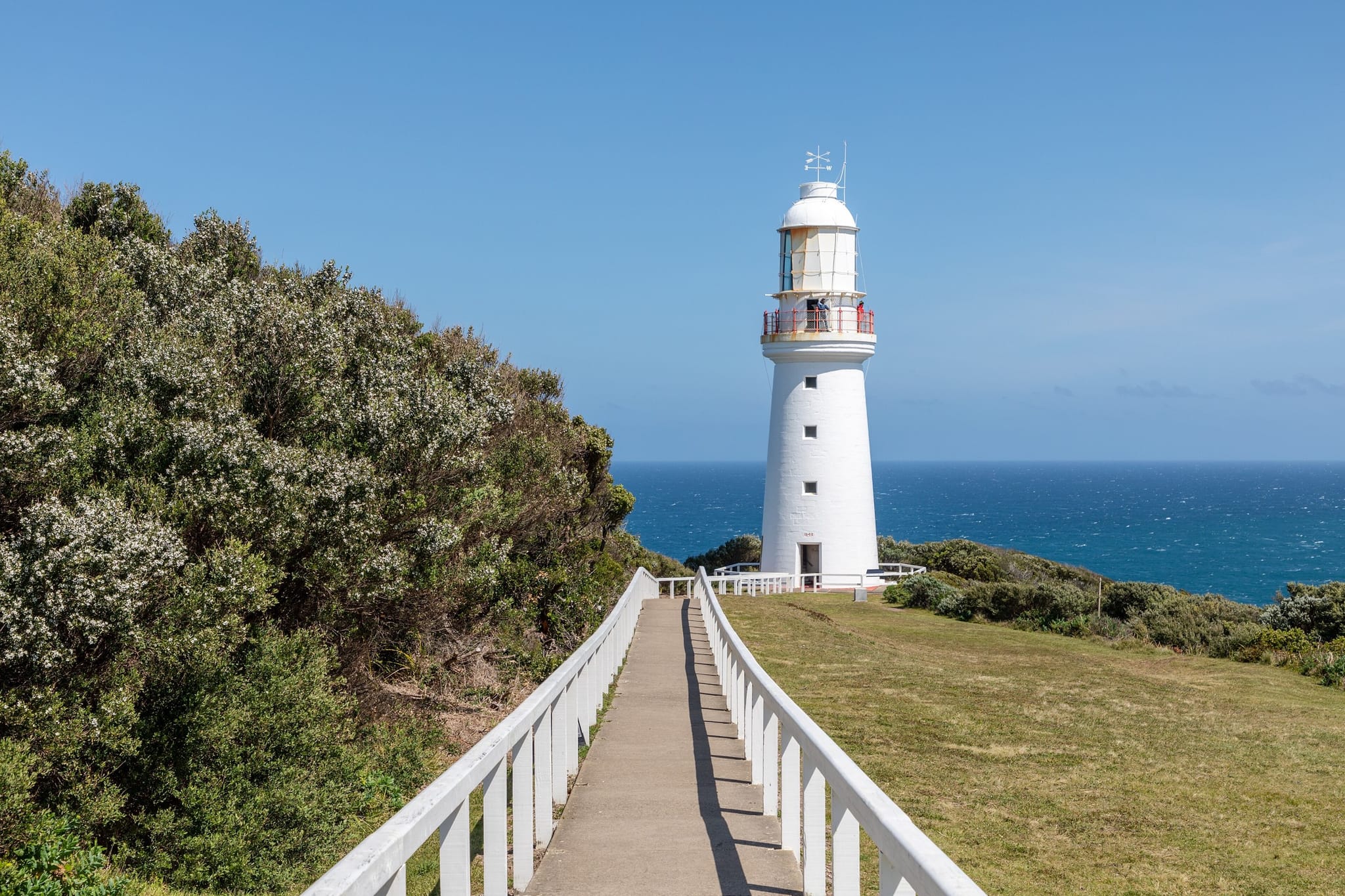 The white Cape Otway Lighthouse standing on the cliff top