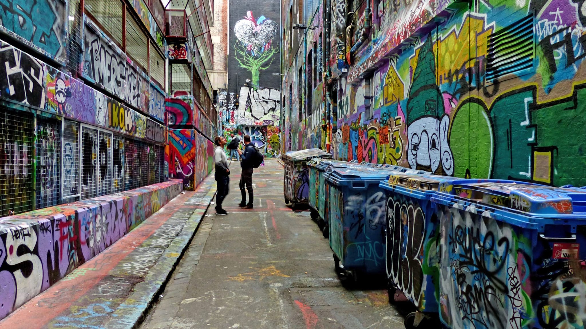 Street art covering the walls and bins of Hosier Lane in Melbourne's city centre