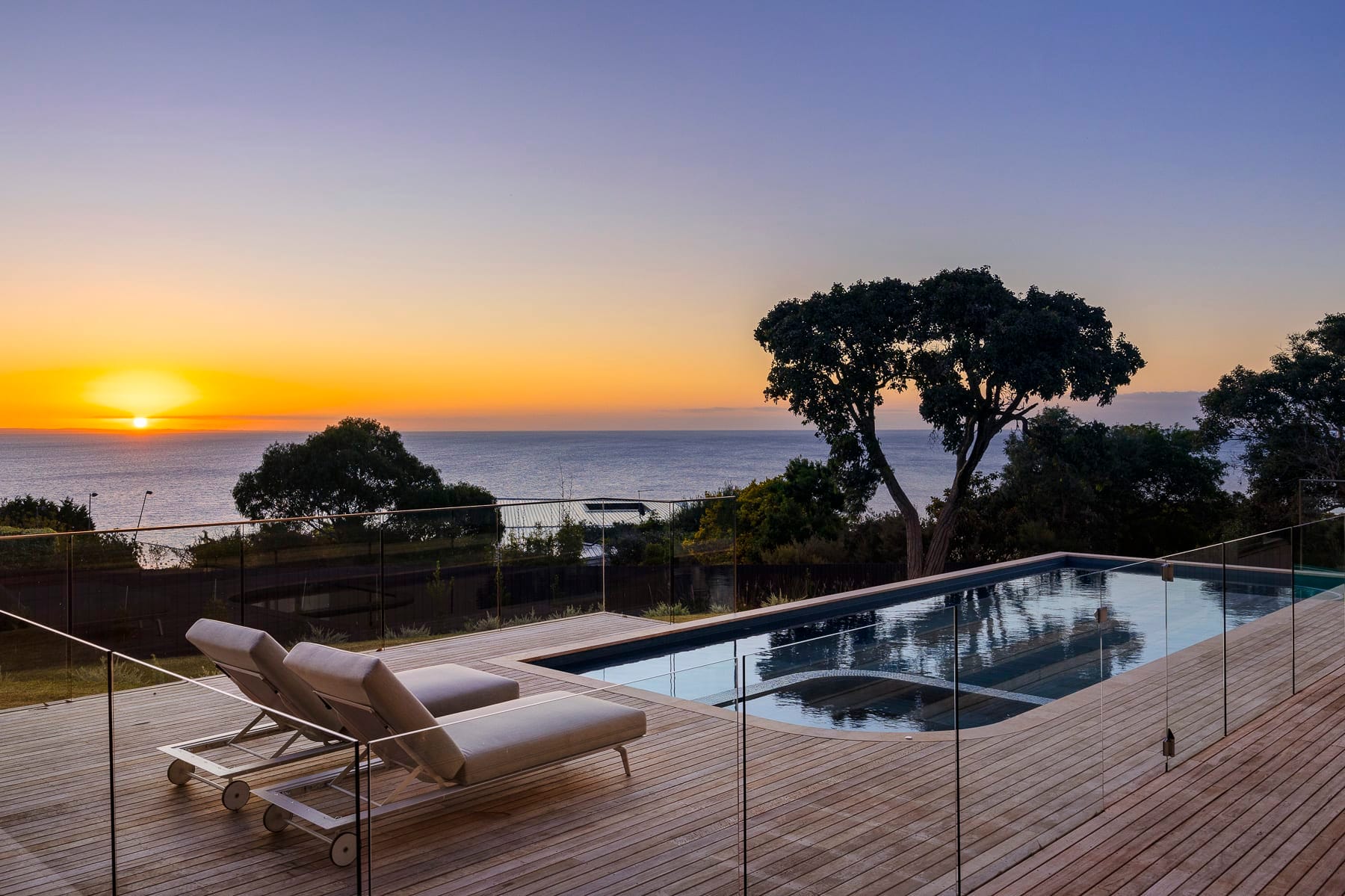 Sunset over the ocean from the pool deck at Blanc de Noir, Mount Martha