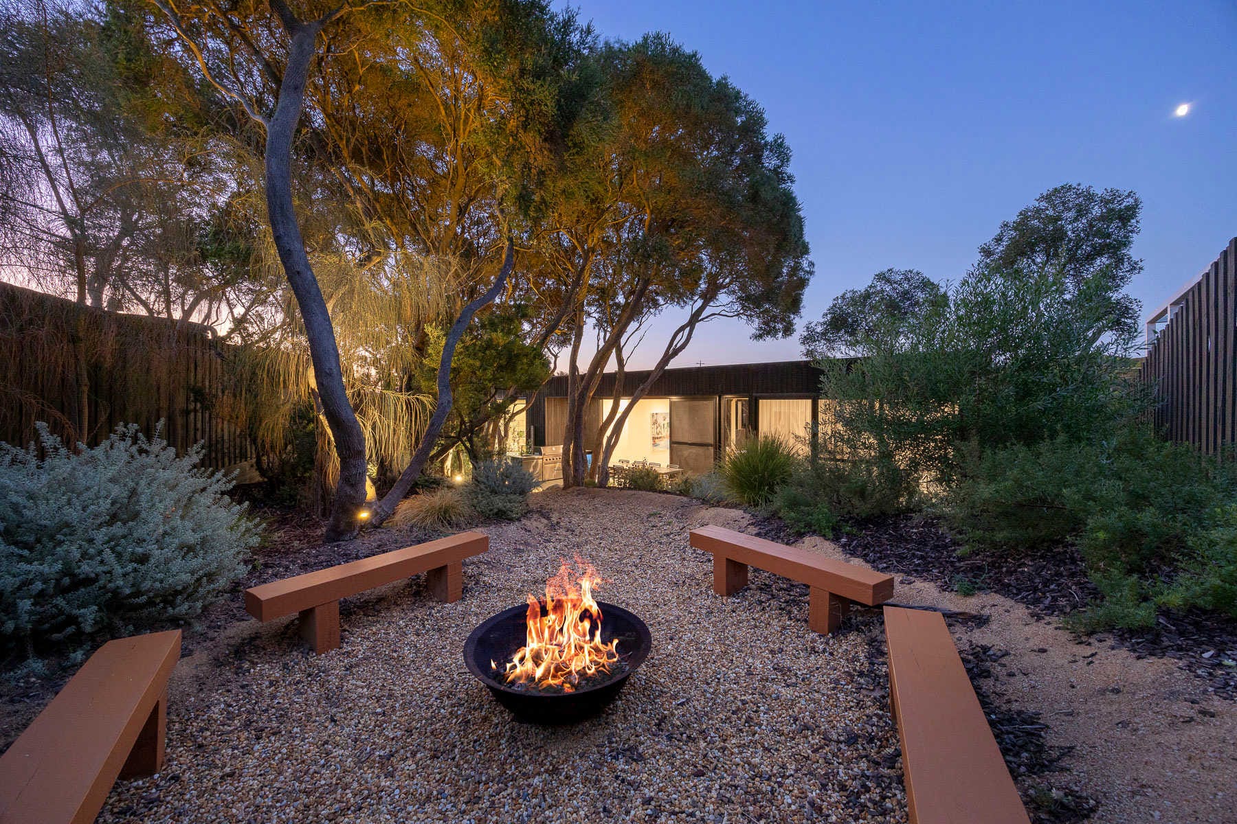 Fire pit among coastal tea trees at The Indoor-Outdoor Retreat in Rye
