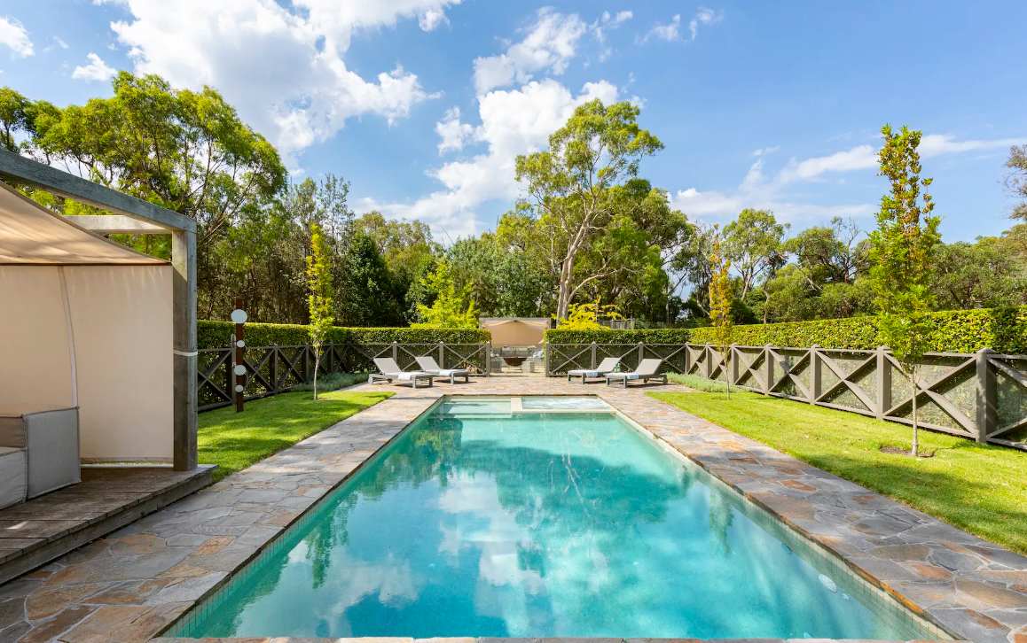 The long pool at Musk Creek with sun loungers along the far side