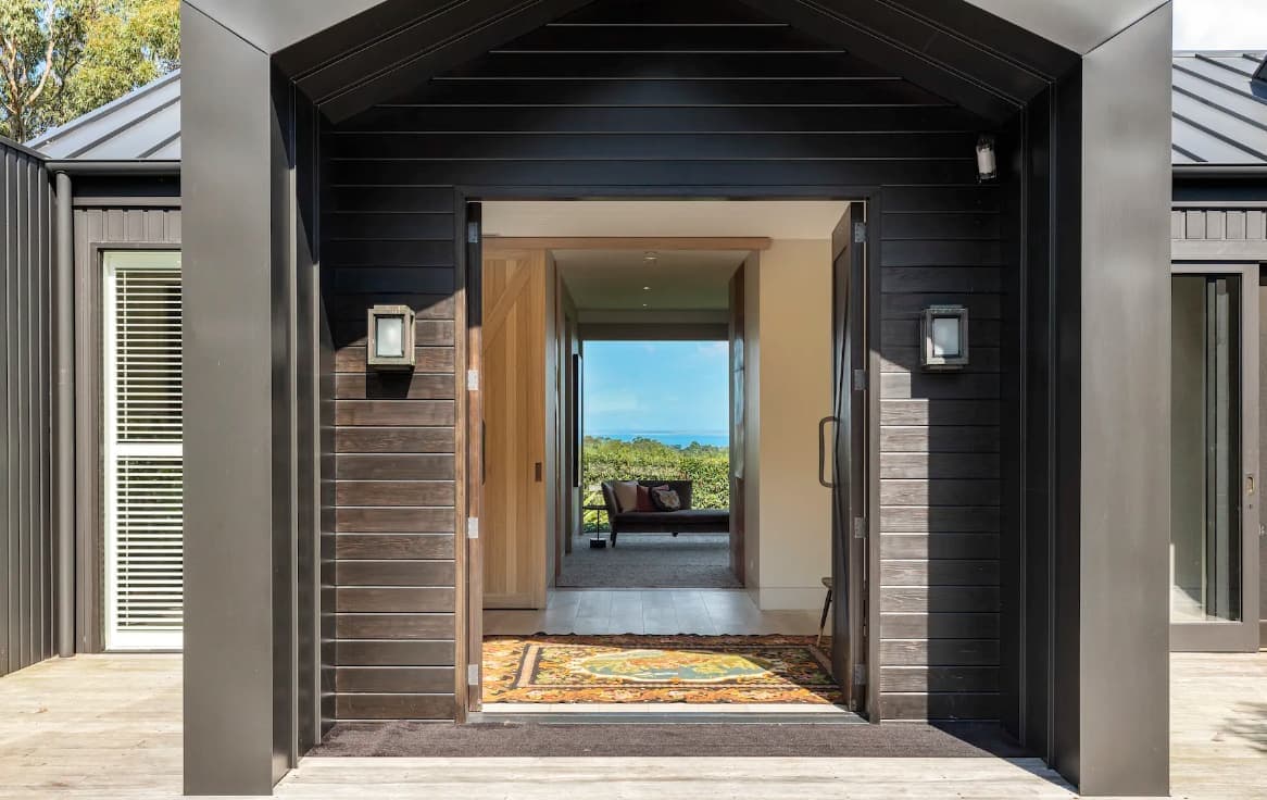 The open entry at Musk Creek with a view straight through the house to the hills