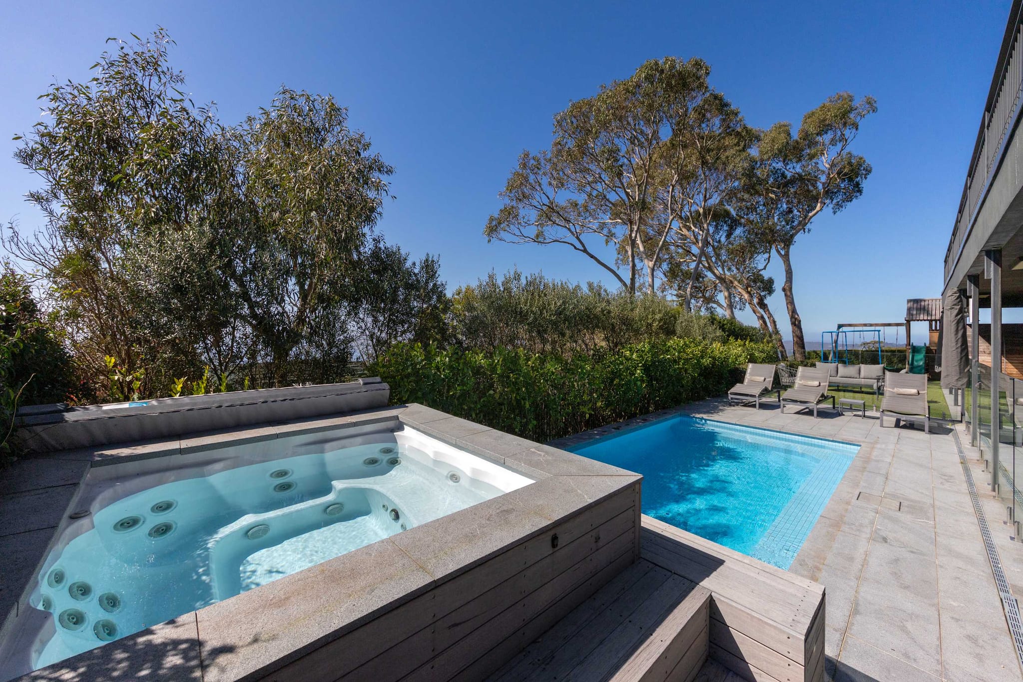Spa and pool among the eucalypts at Summit House, Arthurs Seat
