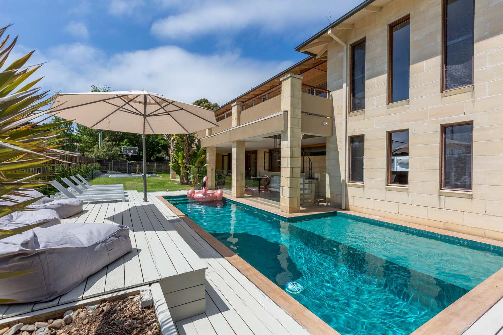 Long pool beside the sandstone-coloured house at Nepean House, Portsea