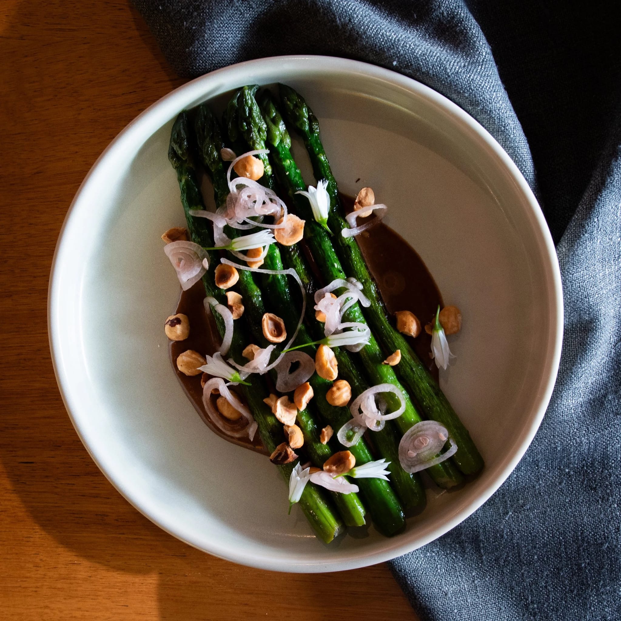 A plated asparagus dish from a private chef