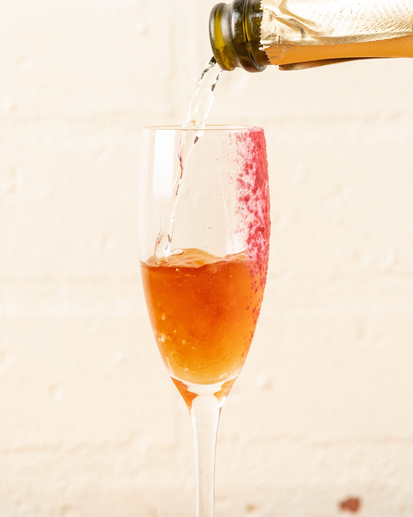 A drink being poured into a flute at The Winey Cow in Mornington