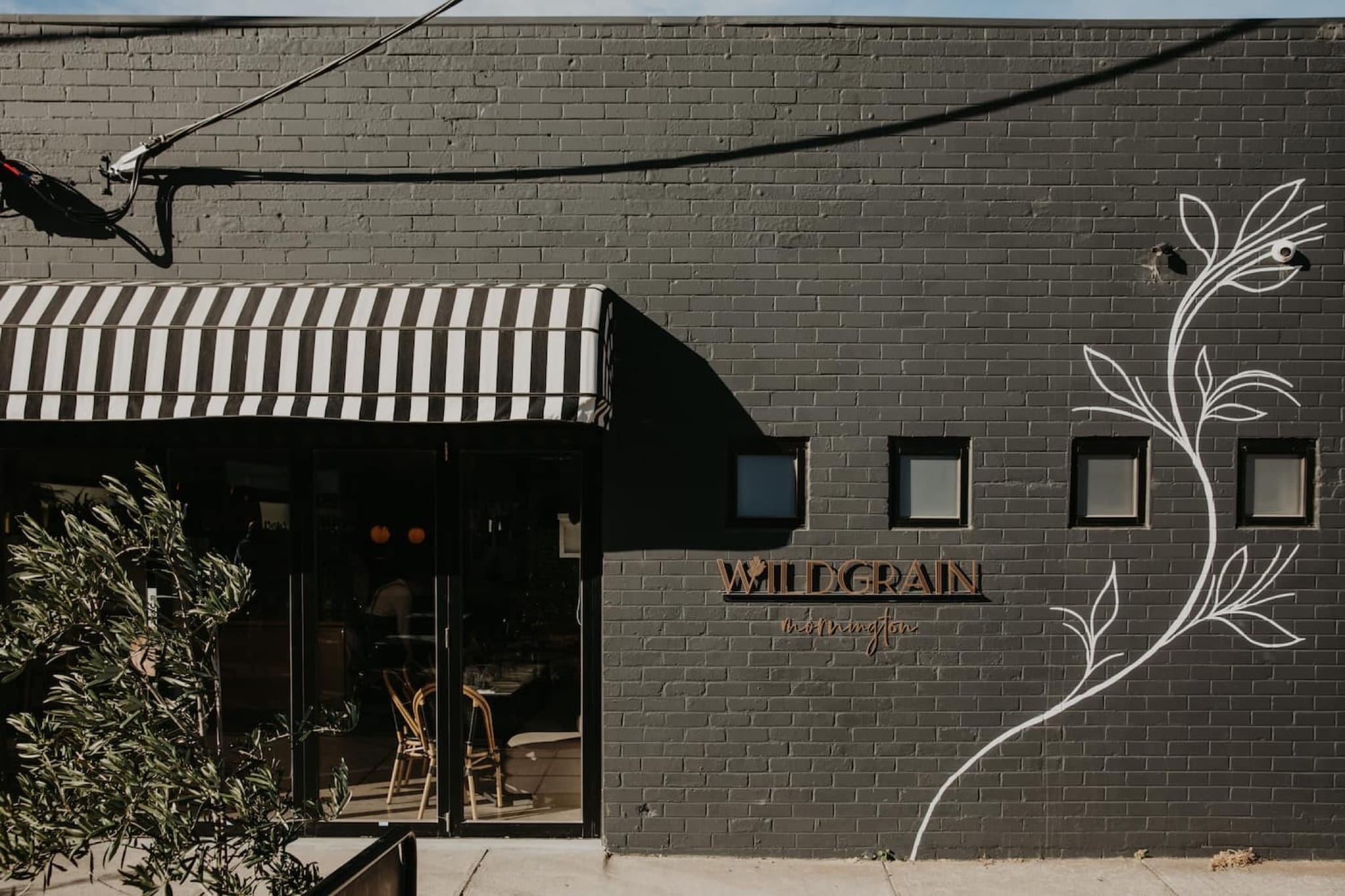 The dark street frontage of Wildgrain restaurant in Mornington