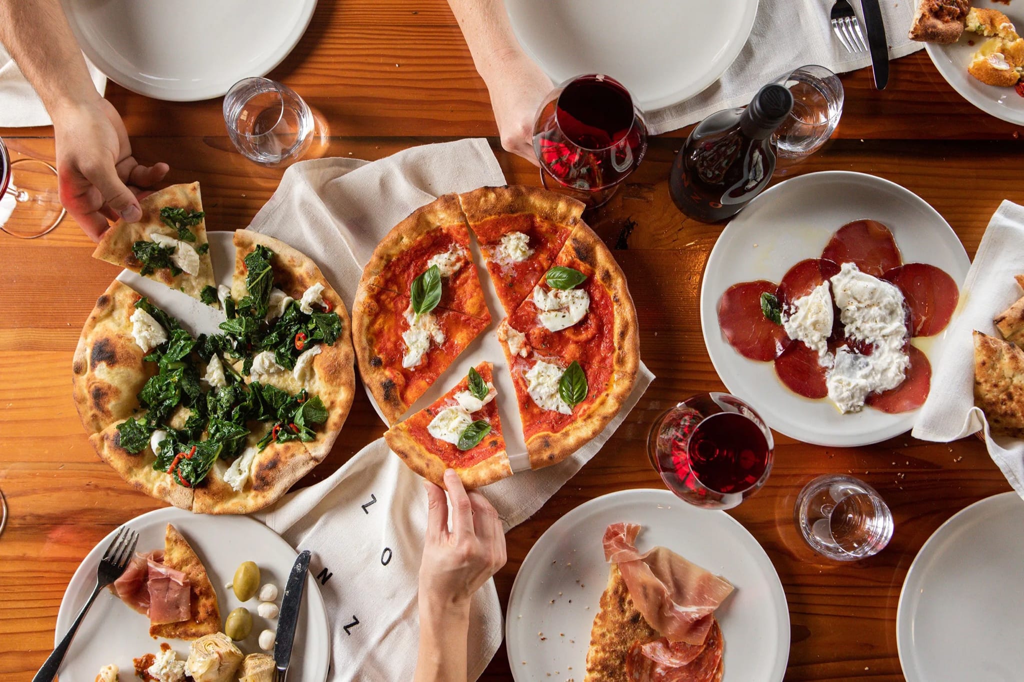 Pizzas and share plates on the table at Zonzo Estate in Yarra Glen