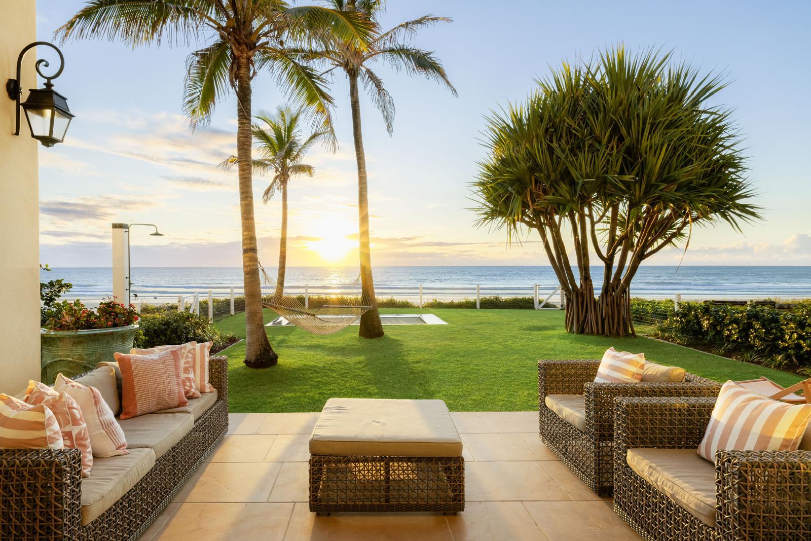 Beachfront terrace at sunrise, looking over the lawn to Mermaid Beach